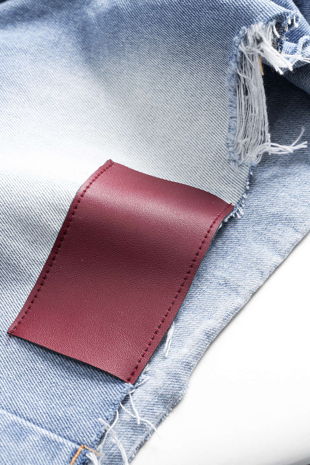 Denim Asymmetrical Button Pocket Ripped Shorts - Image 3